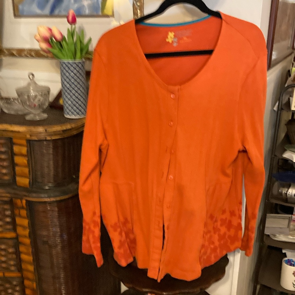 Gudrun Sjoden XL orange button down cardigan with dark orange flowers.